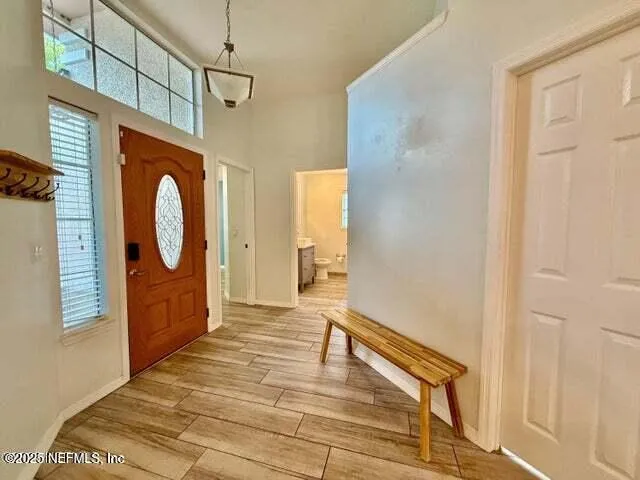 a kitchen with stainless steel appliances a sink a stove top oven a counter space and cabinets