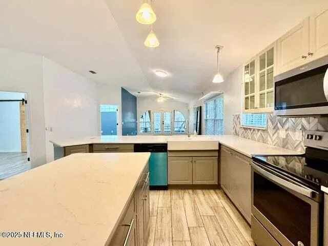 a view of a living room and a large window