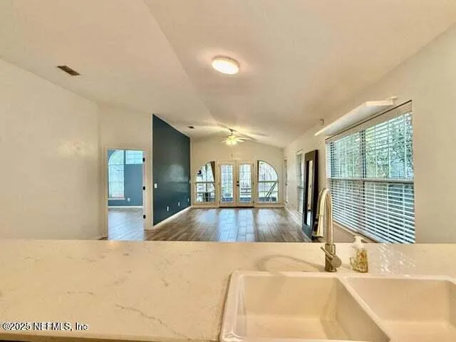 a view of a room with wooden floor and stairs