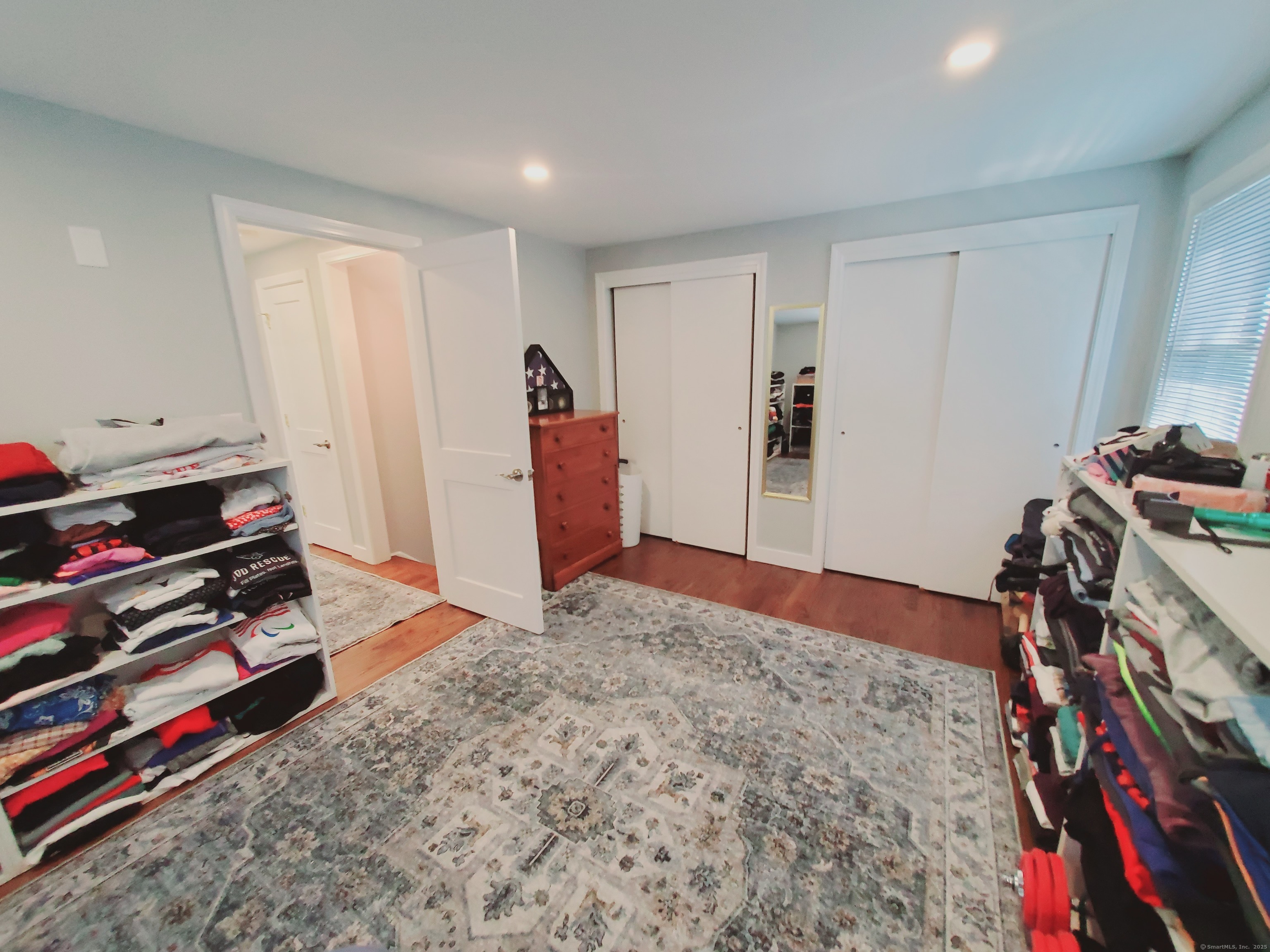 27 Winter Street Stamford, CT 06905 - Photo 13 of 17 a bed room with a bed and a book shelf