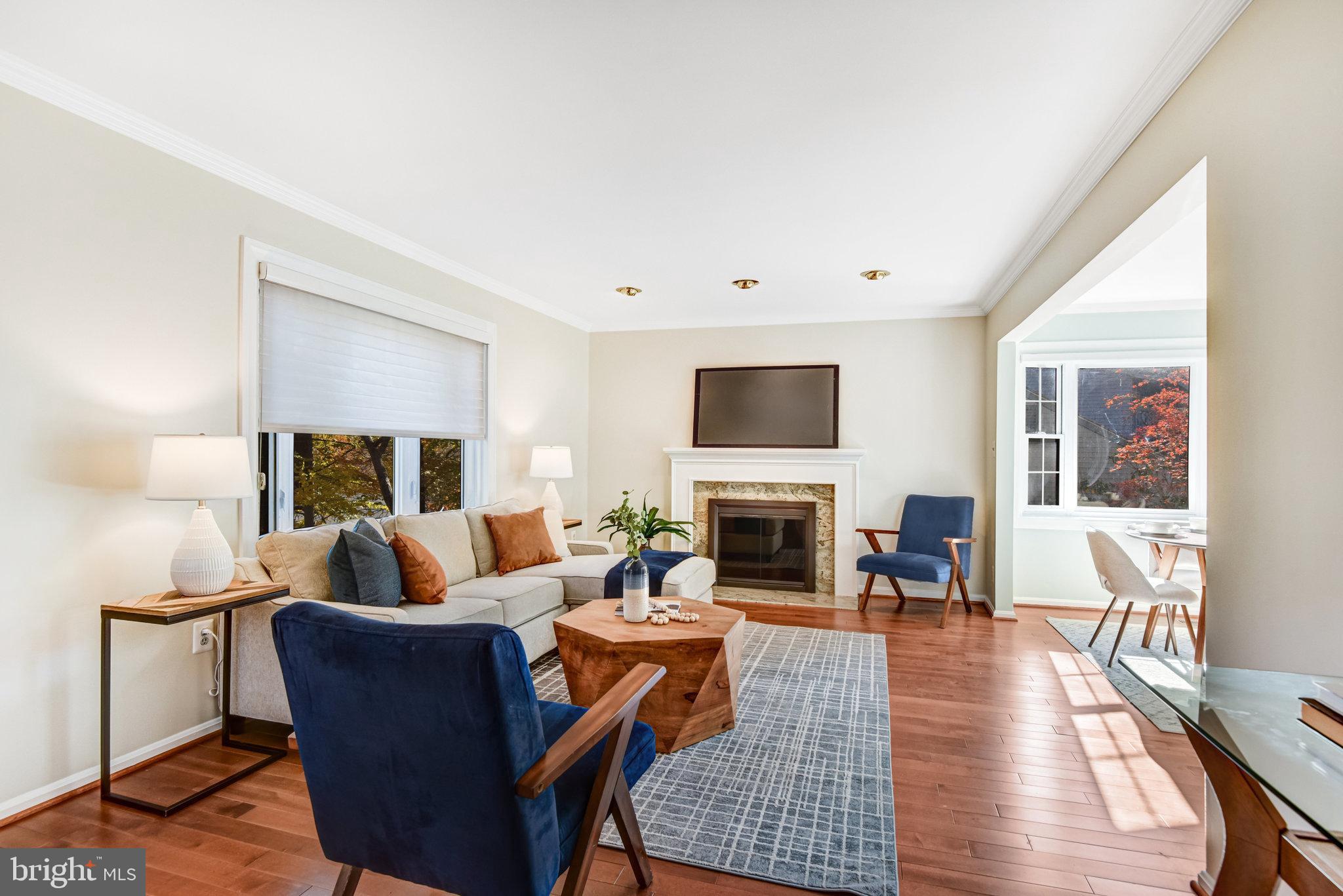 8420 Sweet Pine Court Springfield, VA 22153 - Photo 15 of 45 a living room with furniture and a fireplace