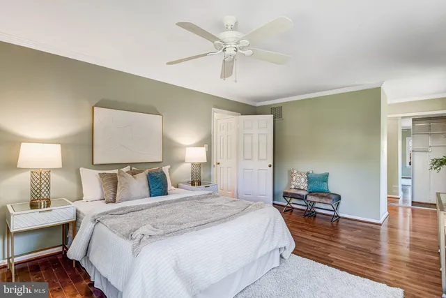 a bedroom with a bed and a table