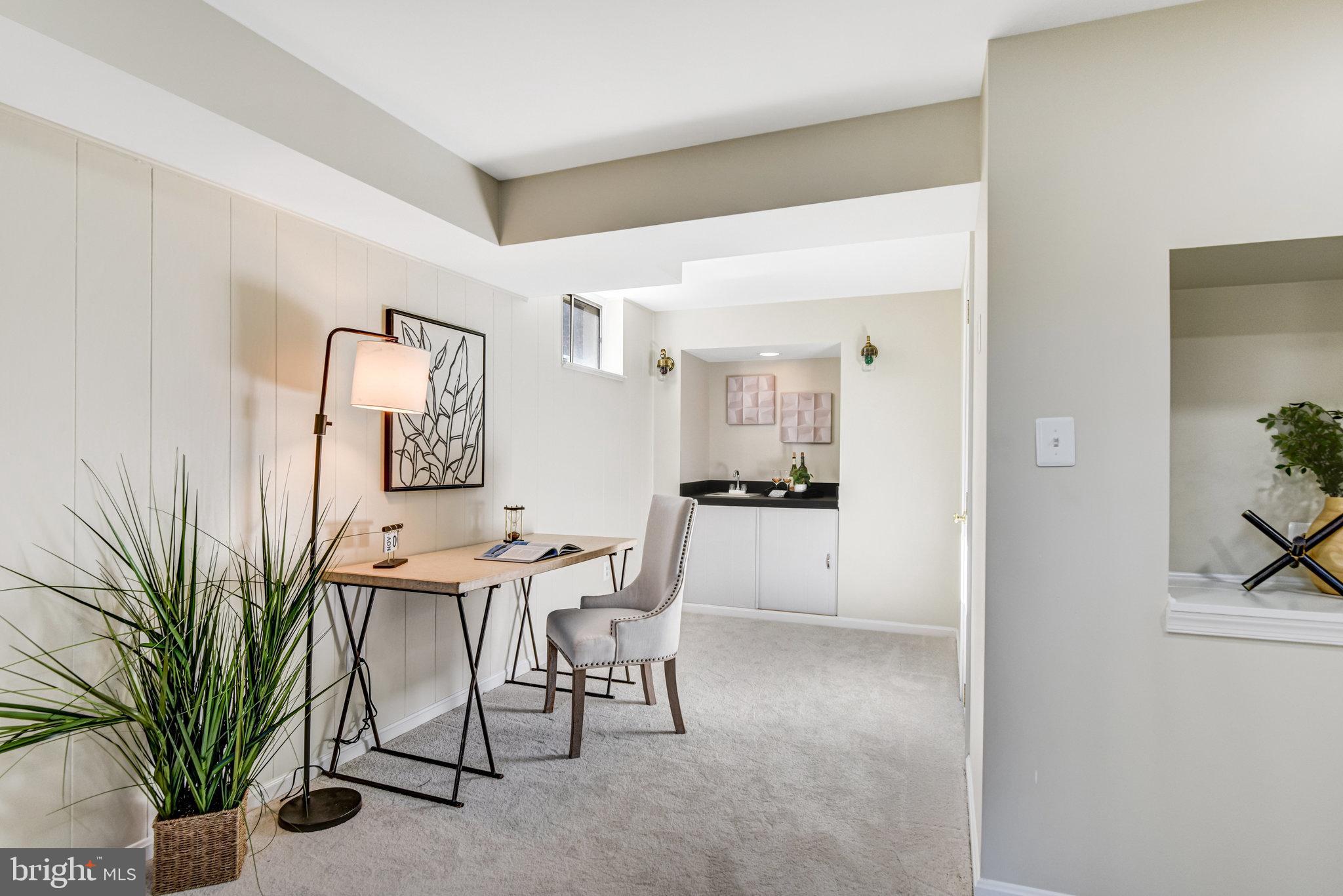 8420 Sweet Pine Court Springfield, VA 22153 - Photo 33 of 45 a view of a livingroom with furniture and a potted plant