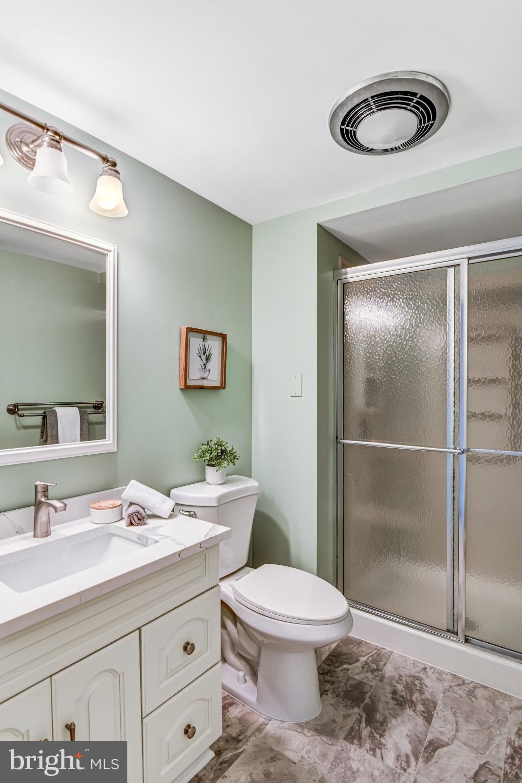 8420 Sweet Pine Court Springfield, VA 22153 - Photo 34 of 45 a bathroom with a granite countertop sink mirror vanity and toilet