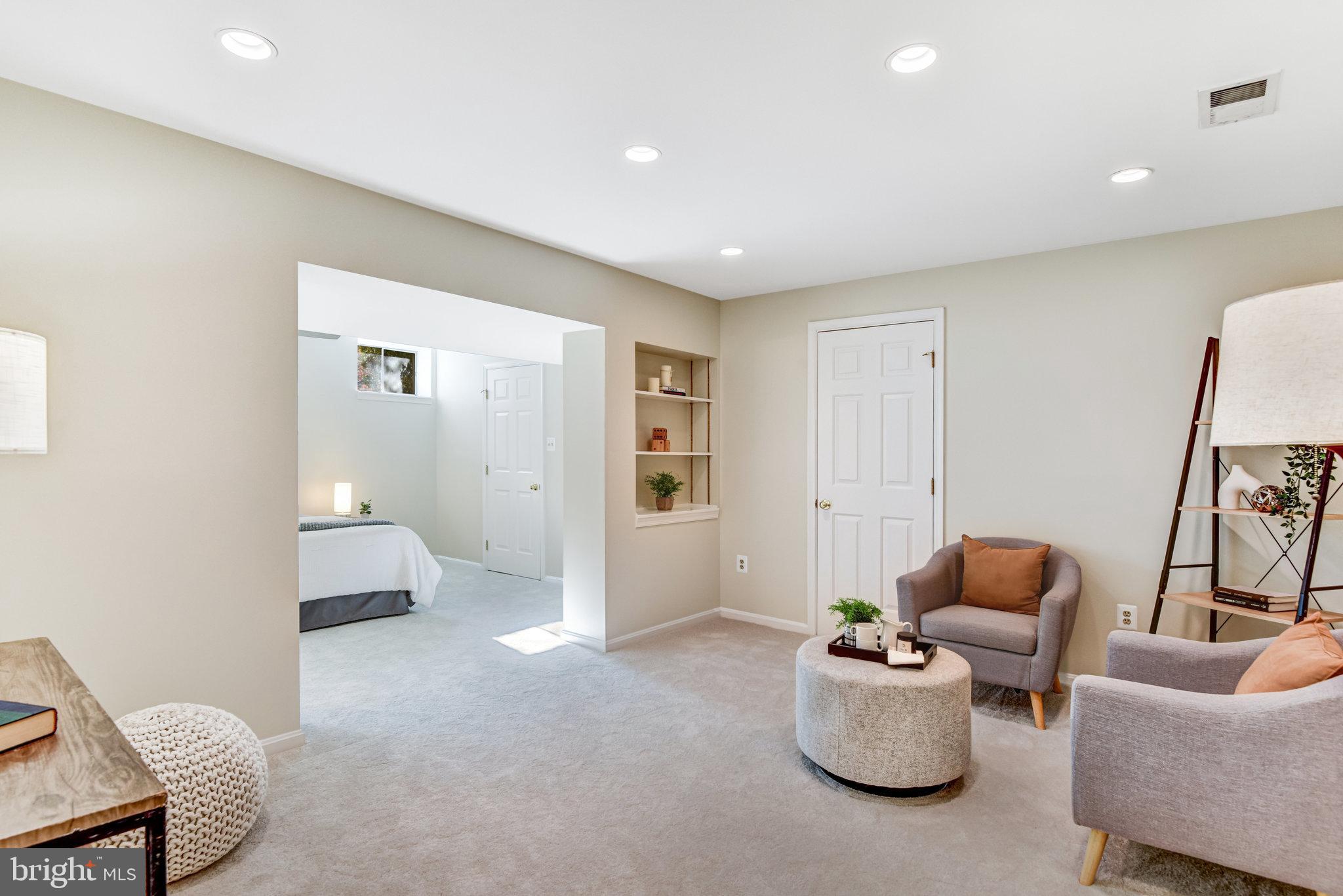 8420 Sweet Pine Court Springfield, VA 22153 - Photo 35 of 45 a living room with furniture and a mirror