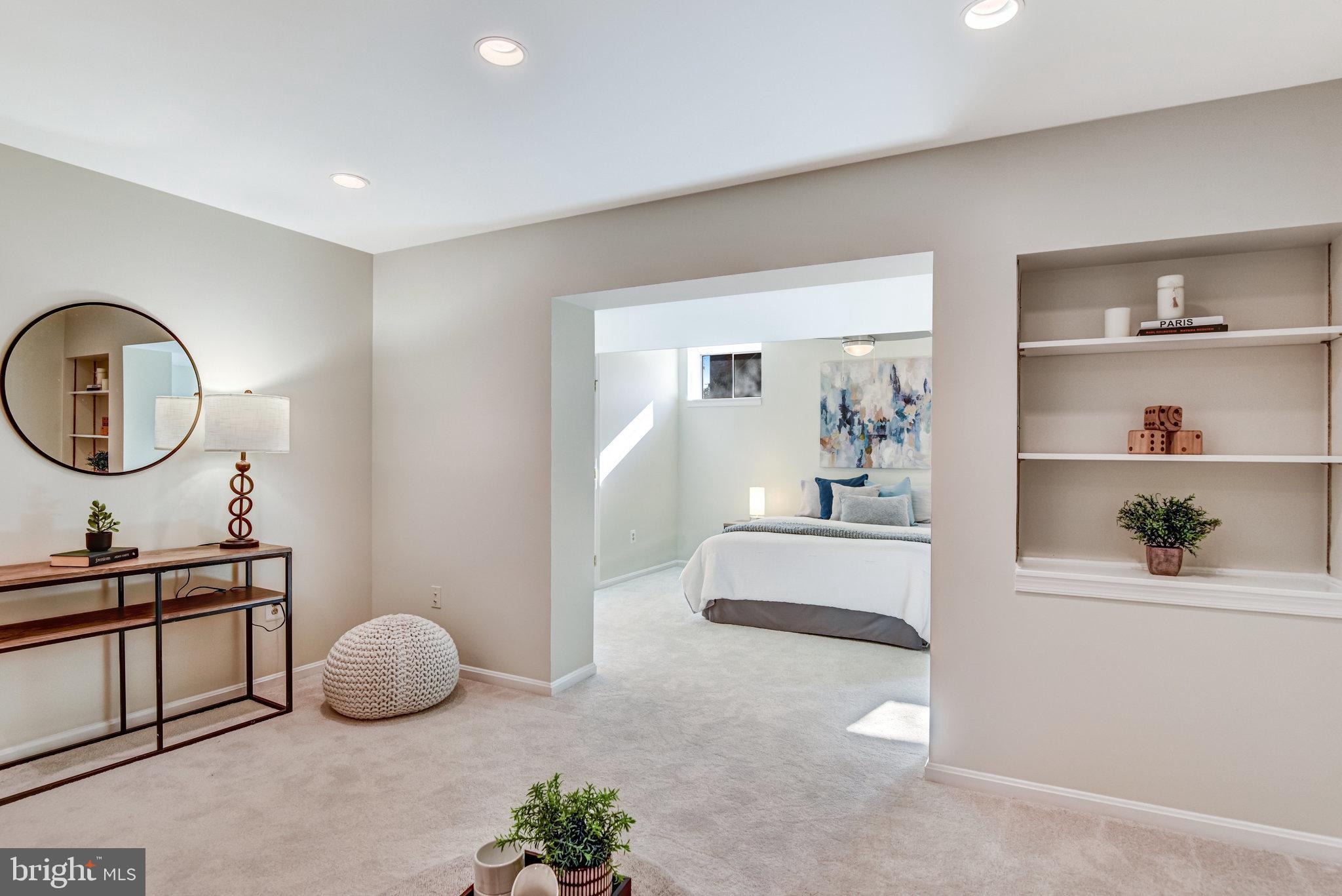 8420 Sweet Pine Court Springfield, VA 22153 - Photo 37 of 45 a living room with furniture and a mirror