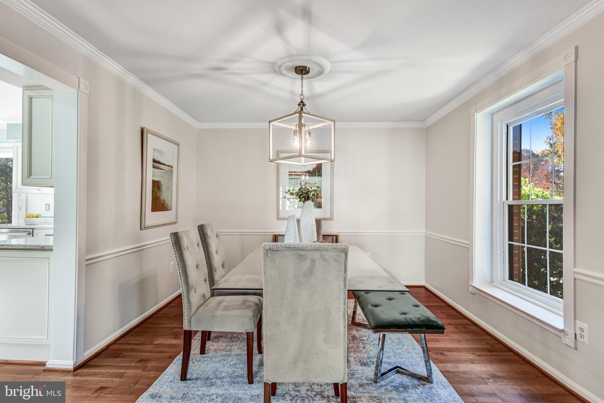 8420 Sweet Pine Court Springfield, VA 22153 - Photo 8 of 45 a view of a dining room with furniture window and wooden floor