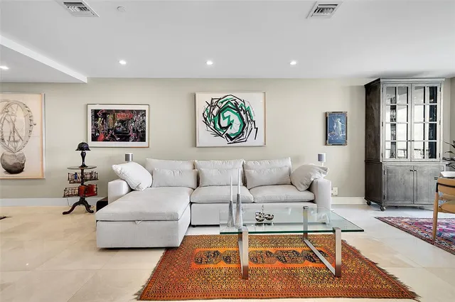 a living room with furniture and a rug