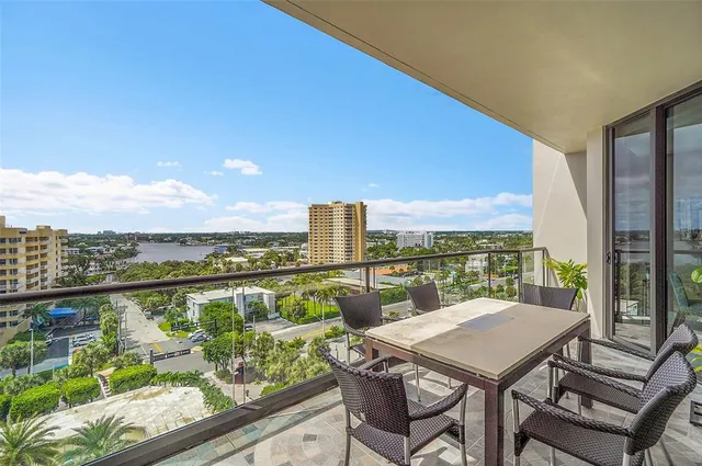 a view of a balcony with lake view and a table