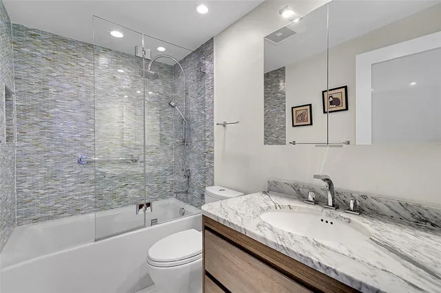 a view of a potted plant sitting in front of a bathroom