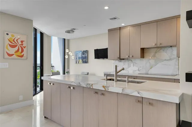 a kitchen with a sink and cabinets