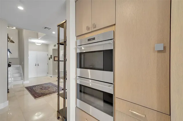 a bathroom with a shower and mirror