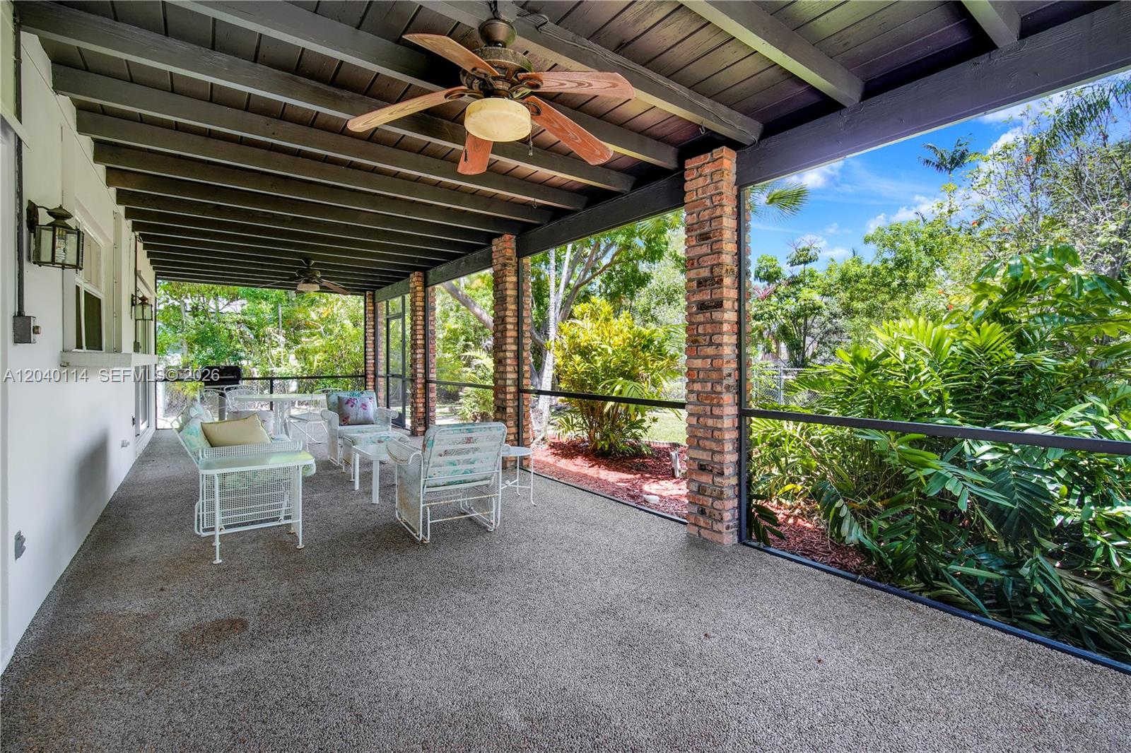 10435 Southwest 96th Street Miami, FL 33176 - Photo 31 of 44 39' x 12' covered and screened-in patio ready for your afternoon BBQ's