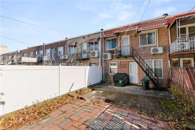 a view of a house with a wooden deck