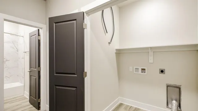 a bathroom with a sink toilet vanity and shower