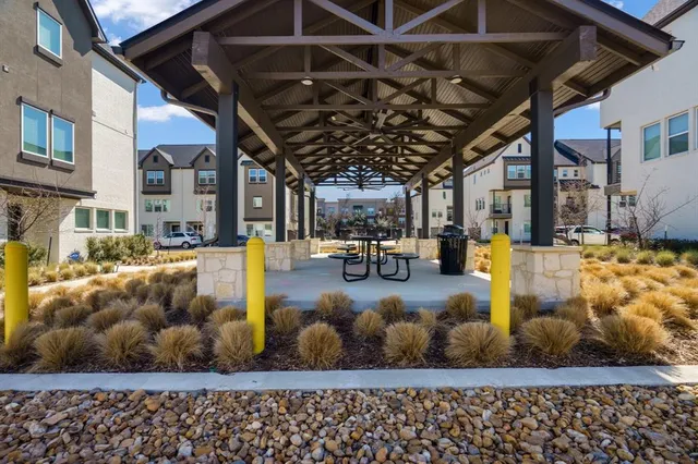 a view of a patio with table and chairs with wooden floor