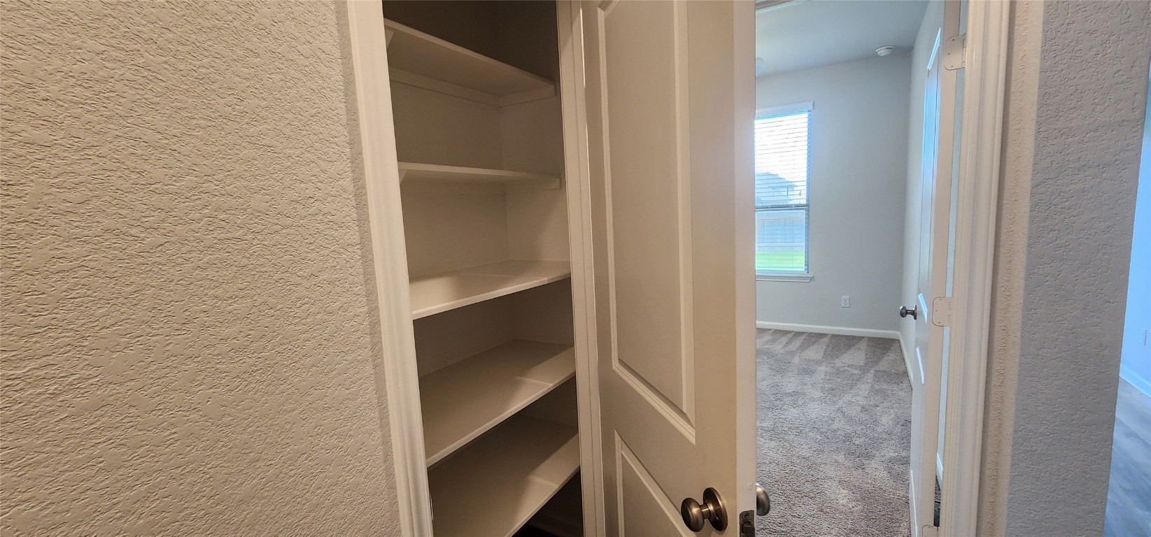 109 Wynne Cove Georgetown, TX 78628 - Photo 12 of 36 a view of an empty walk in closet