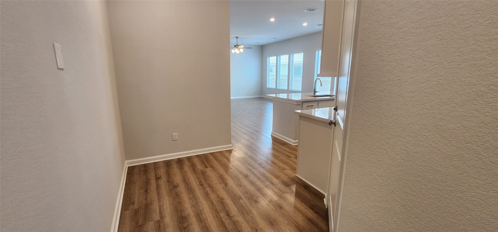 109 Wynne Cove Georgetown, TX 78628 - Photo 3 of 36 wooden floor in a hall with an entryway
