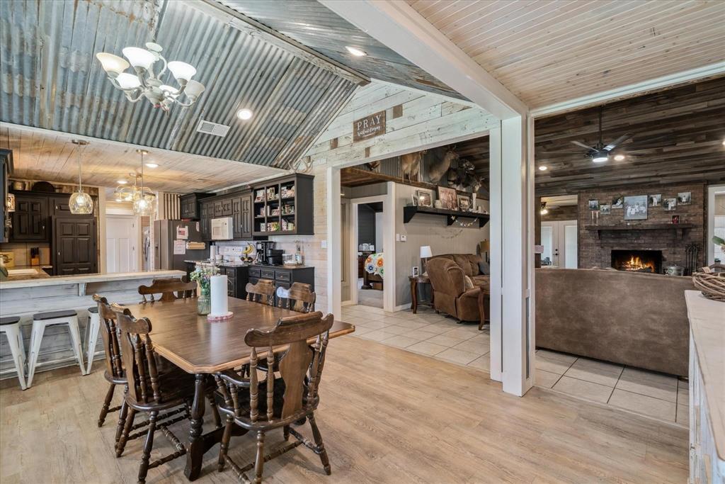 350 Alaska Street Van, TX 75790 - Photo 11 of 37 a dining room with furniture and a fireplace