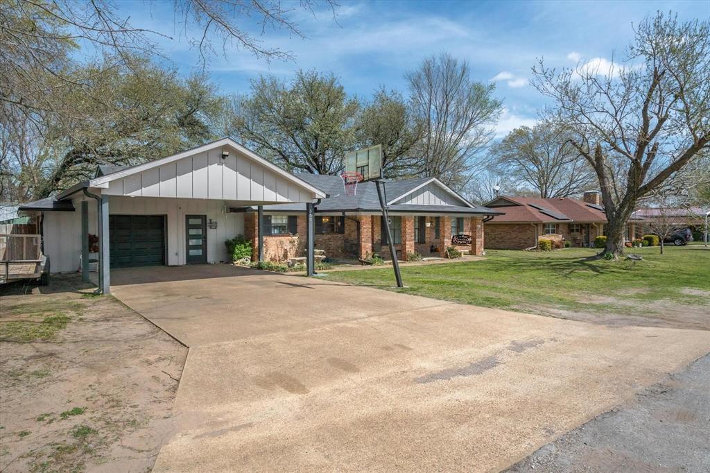 350 Alaska Street Van, TX 75790 - Photo 3 of 37 a patio with a table and chairs under an umbrella
