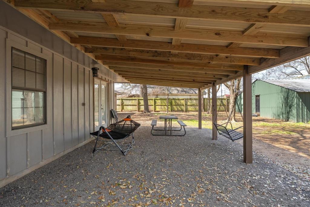 350 Alaska Street Van, TX 75790 - Photo 33 of 37 a living room with furniture and a flat screen tv