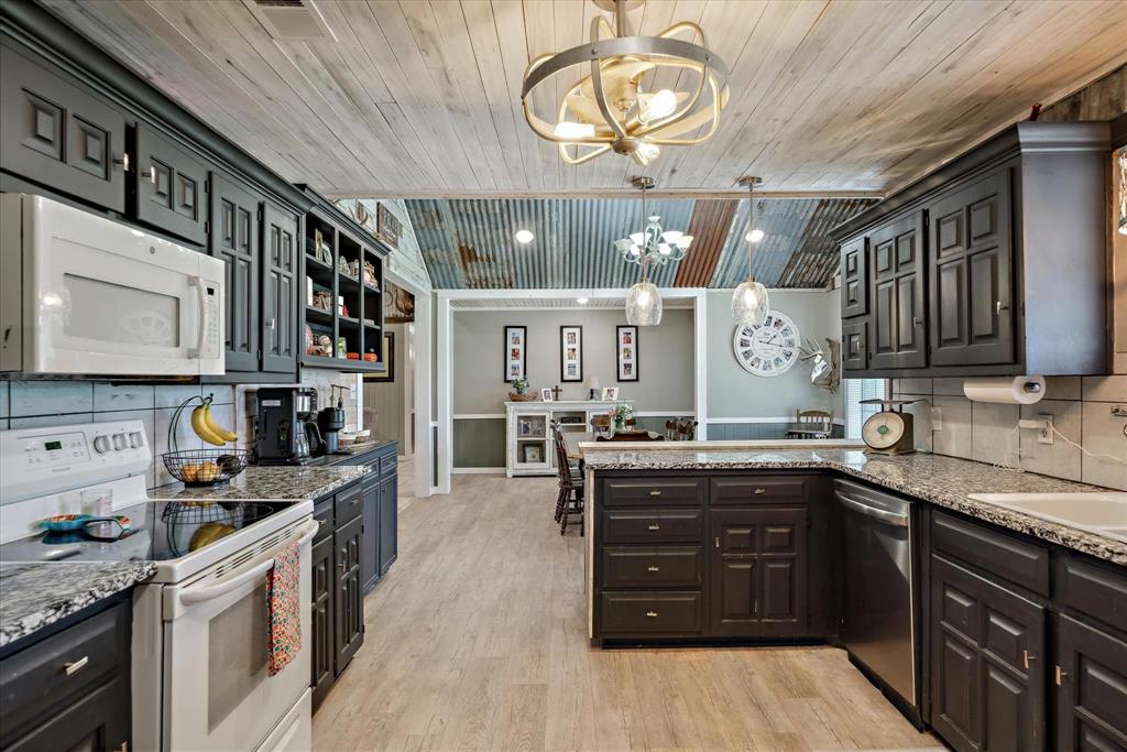 350 Alaska Street Van, TX 75790 - Photo 7 of 37 a kitchen with a sink and cabinets