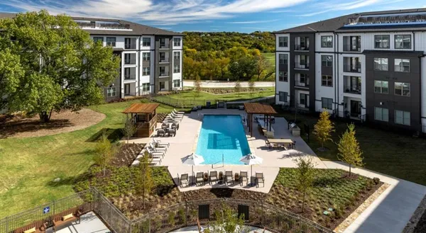 a view of a house with backyard outdoor seating area and swimming pool