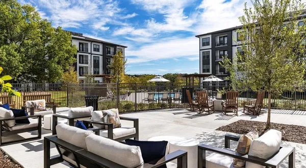 a view of a patio with couches and chairs