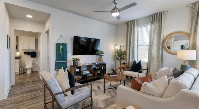 a living room with furniture and a flat screen tv