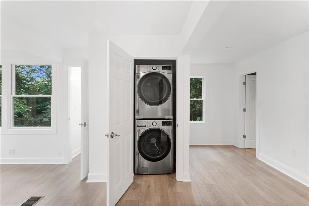 875 Dickson Road Sewickley, PA 15143 - Photo 11 of 29 a view of a hallway with washer and dryer