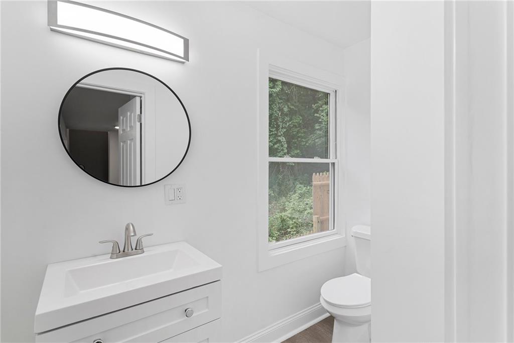 875 Dickson Road Sewickley, PA 15143 - Photo 12 of 29 a bathroom with a sink a mirror and a toilet