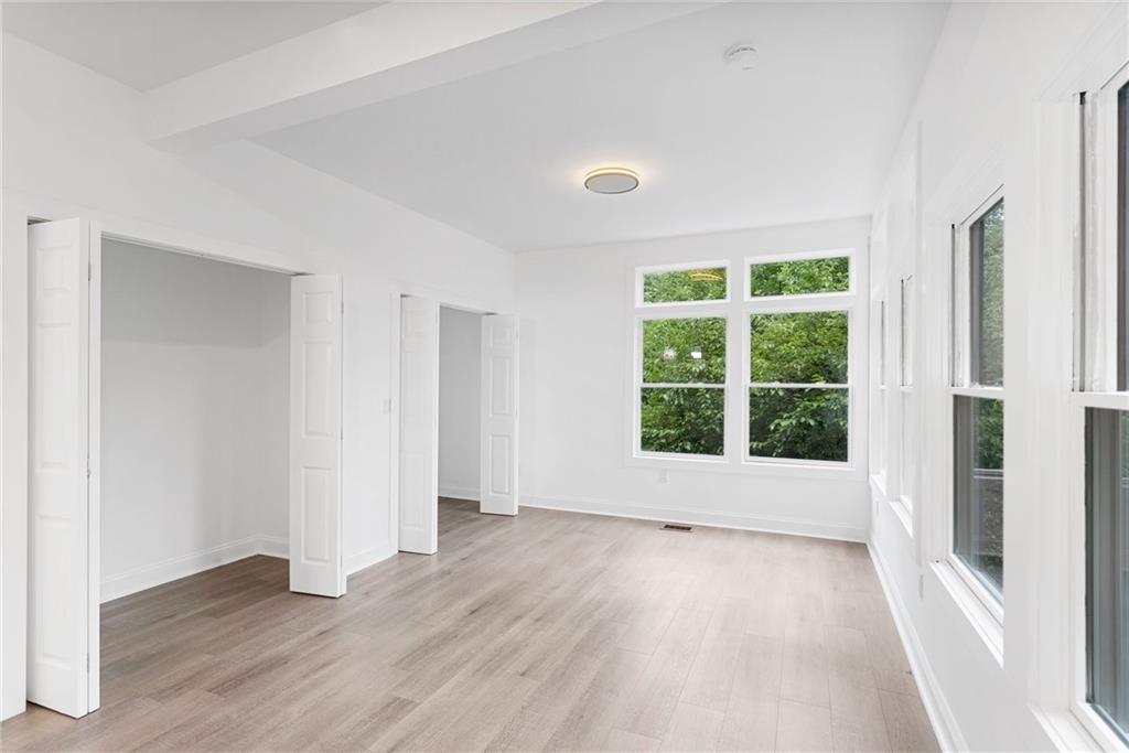 875 Dickson Road Sewickley, PA 15143 - Photo 15 of 29 a view of an empty room with wooden floor and a window