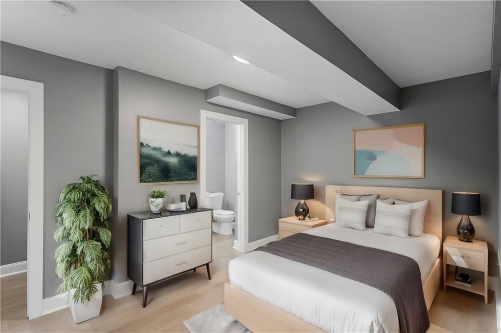 875 Dickson Road Sewickley, PA 15143 - Photo 17 of 29 a bedroom with a bed and a potted plant