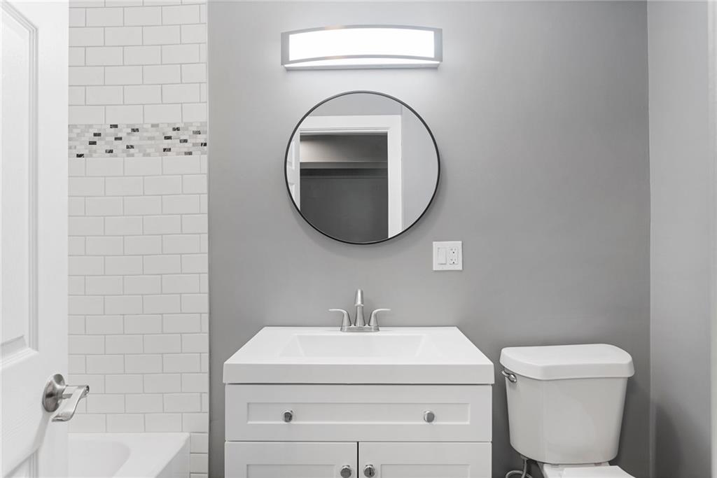 875 Dickson Road Sewickley, PA 15143 - Photo 19 of 29 a bathroom with a toilet sink and mirror