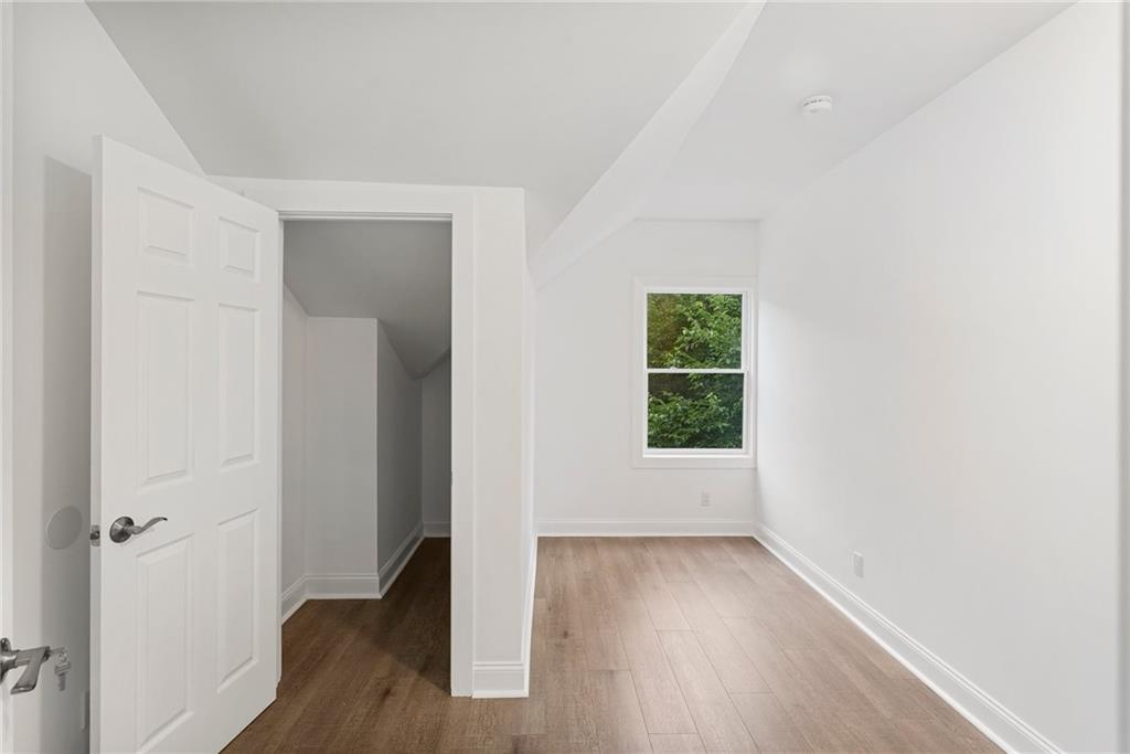 875 Dickson Road Sewickley, PA 15143 - Photo 21 of 29 an empty room with wooden floor and window