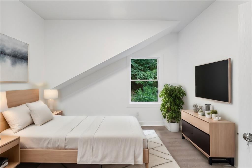 875 Dickson Road Sewickley, PA 15143 - Photo 22 of 29 a bedroom with a large bed and a flat screen tv