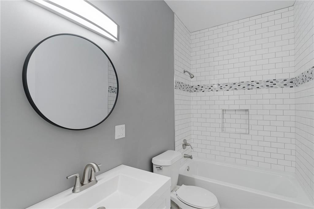 875 Dickson Road Sewickley, PA 15143 - Photo 26 of 29 a bathroom with a sink and a mirror