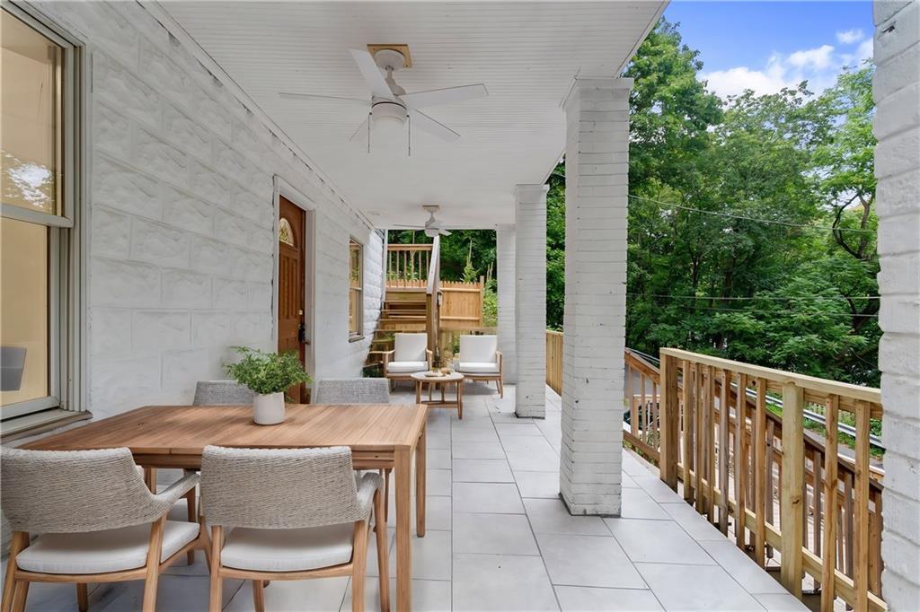 875 Dickson Road Sewickley, PA 15143 - Photo 3 of 29 a view of a patio with table and chairs with wooden floor and plants