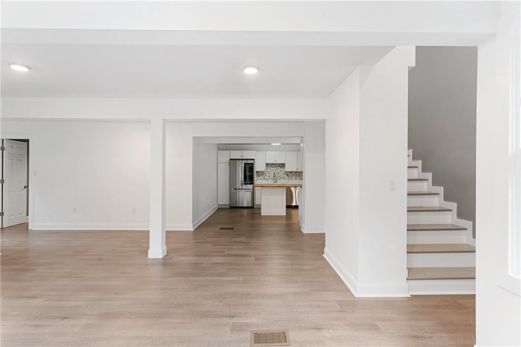 875 Dickson Road Sewickley, PA 15143 - Photo 8 of 29 a view of a hallway with wooden floor and staircase