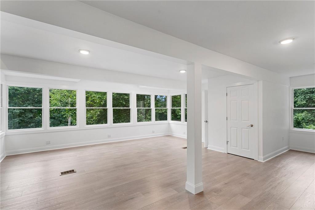 875 Dickson Road Sewickley, PA 15143 - Photo 9 of 29 a view of an empty room with a window and wooden floor