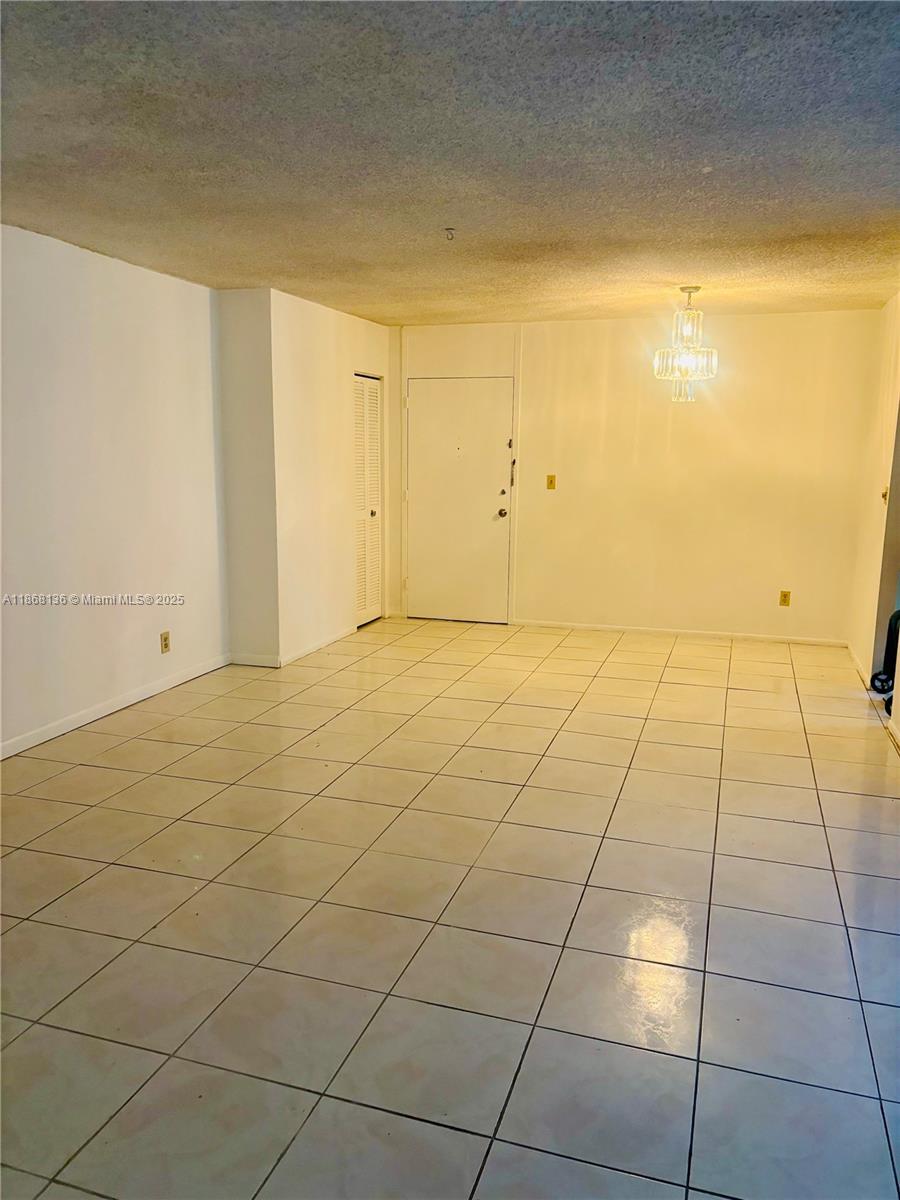 950 Northeast 199th Street, Unit 1A 101 Miami, FL 33179 - Photo 6 of 10 a view of empty room