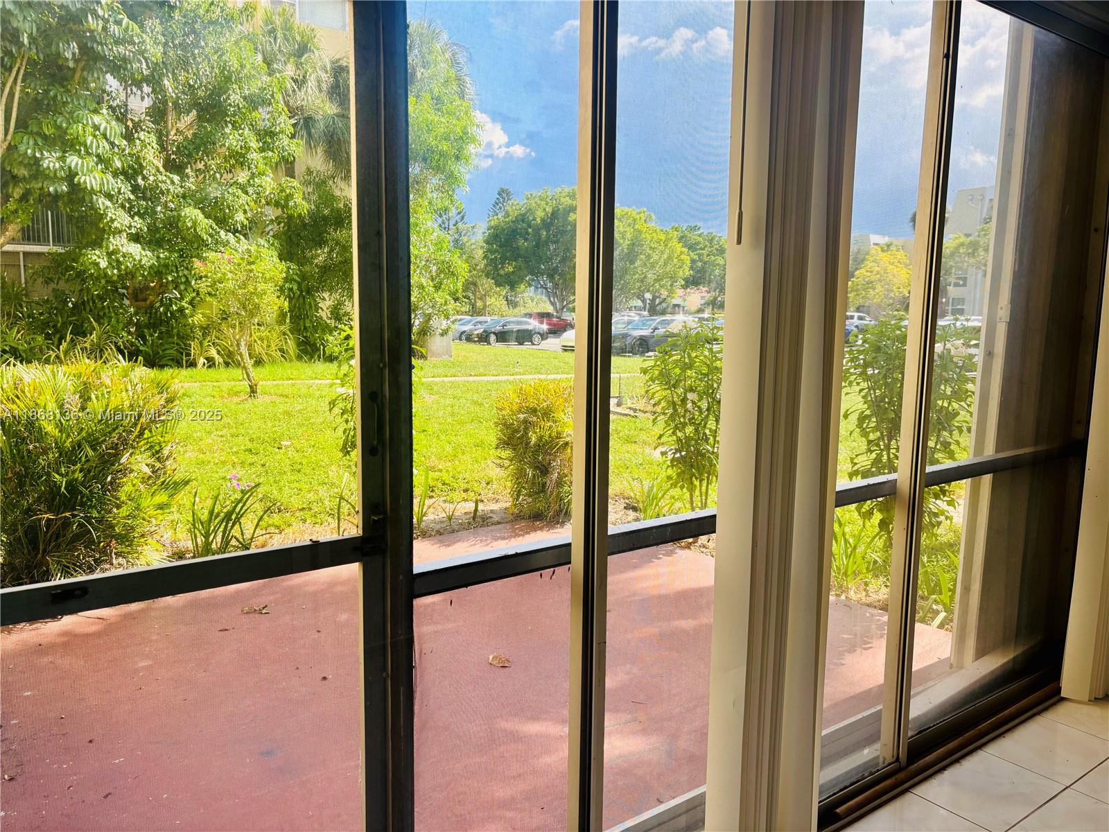 950 Northeast 199th Street, Unit 1A 101 Miami, FL 33179 - Photo 10 of 10 a view of an outdoor from window