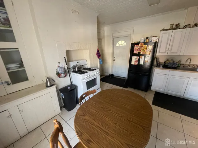 a bedroom with a bed and a chair in it