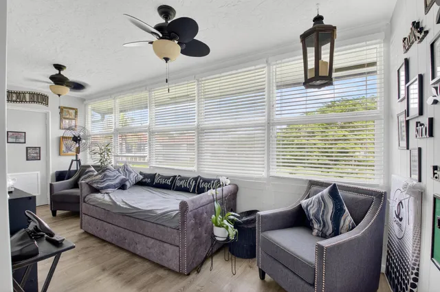 an aerial view of a house with yard swimming pool and outdoor seating