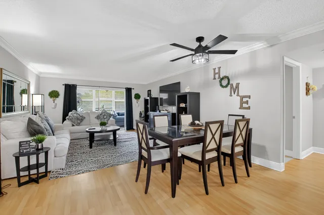 a view of a dining room with furniture and wooden floor