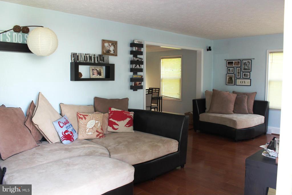 46695 Yorktown Road Lexington Park, MD 20653 - Photo 2 of 14 a living room with furniture and a potted plant