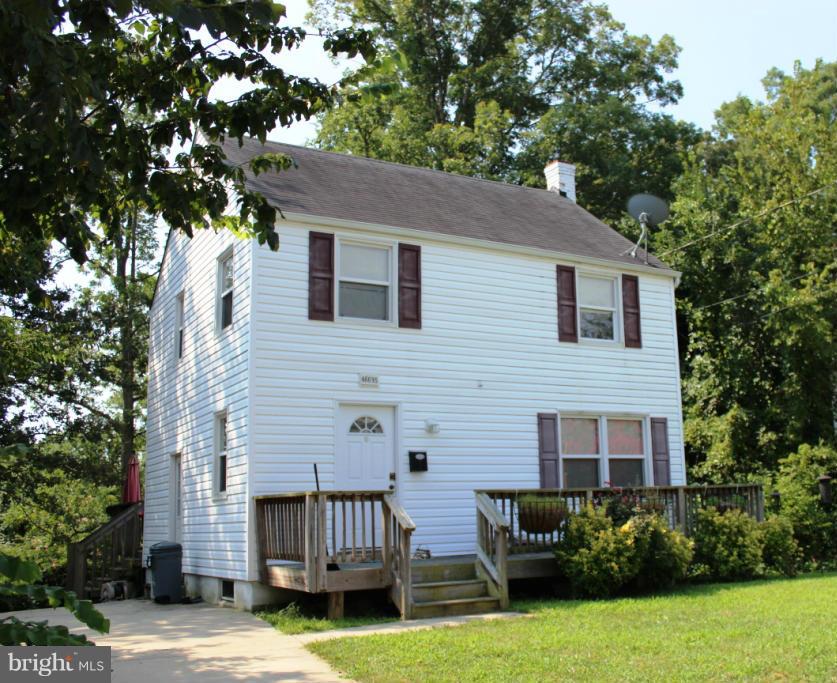 46695 Yorktown Road Lexington Park, MD 20653 - Photo 14 of 14 a brick house with garden in front of it