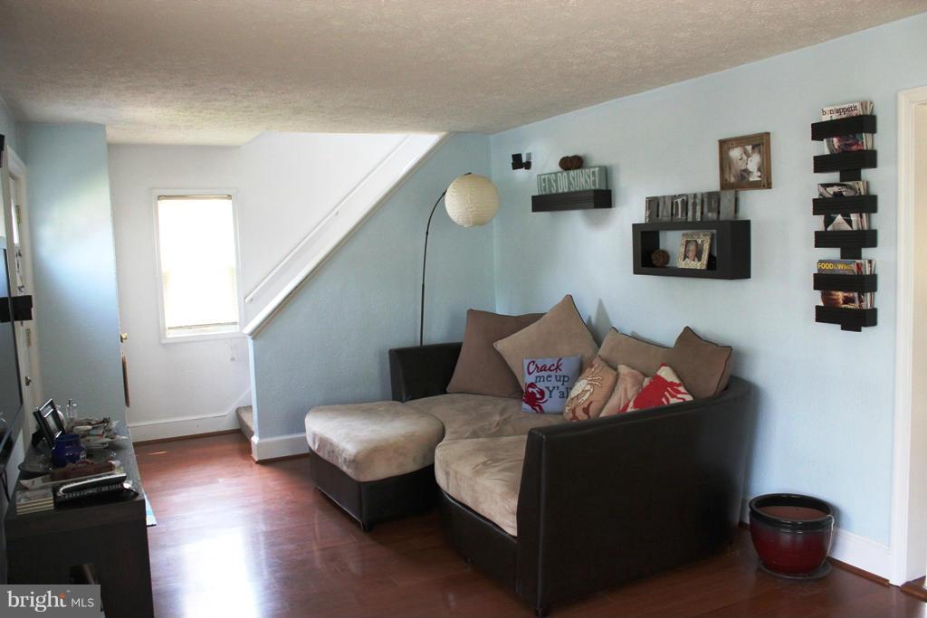 46695 Yorktown Road Lexington Park, MD 20653 - Photo 3 of 14 a living room with furniture and wooden floor