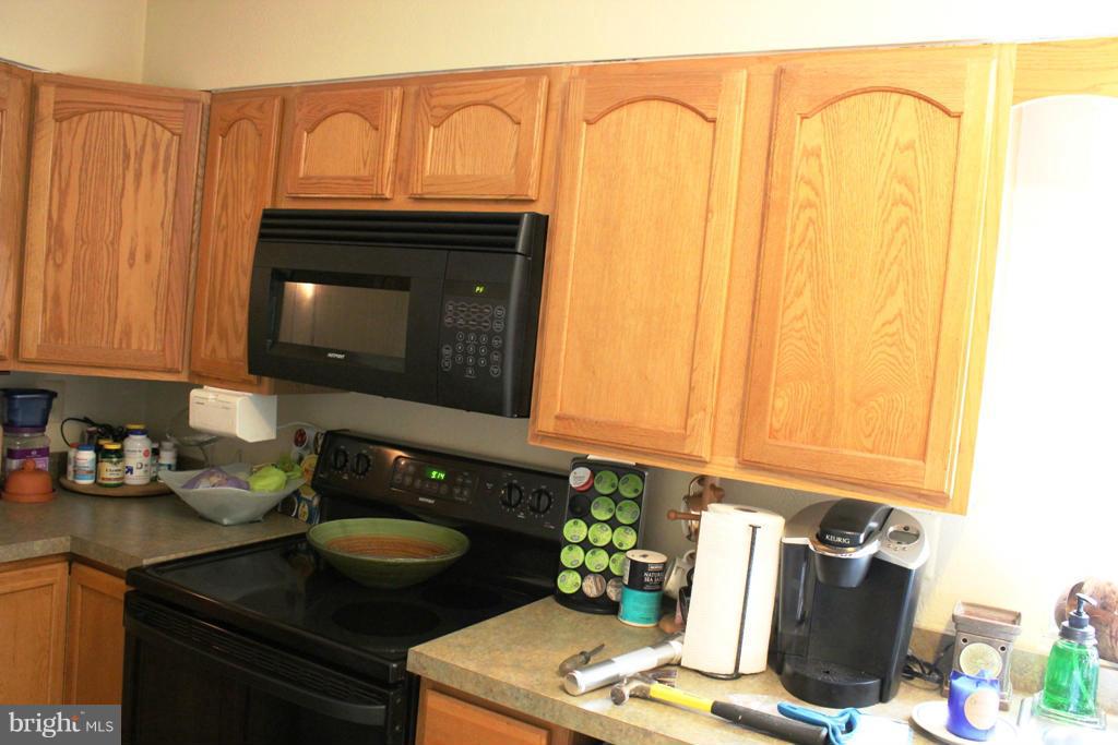 46695 Yorktown Road Lexington Park, MD 20653 - Photo 5 of 14 a kitchen with a stove and a microwave