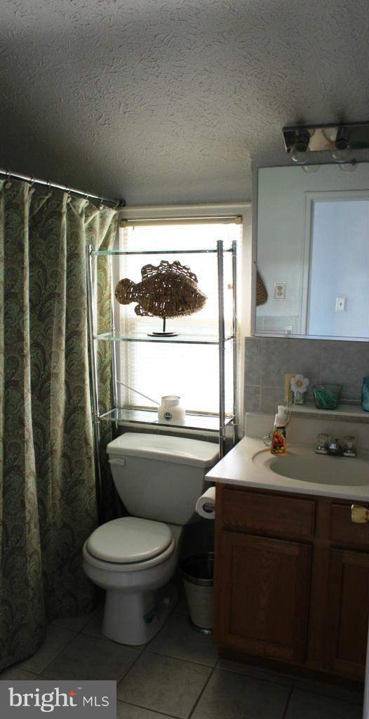 46695 Yorktown Road Lexington Park, MD 20653 - Photo 7 of 14 a bathroom with a sink toilet and shower